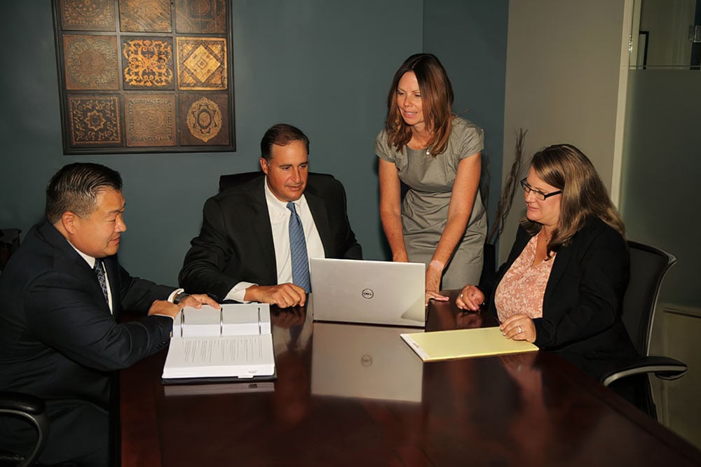 Attorneys meeting at Tang & Maravelis, P.C.